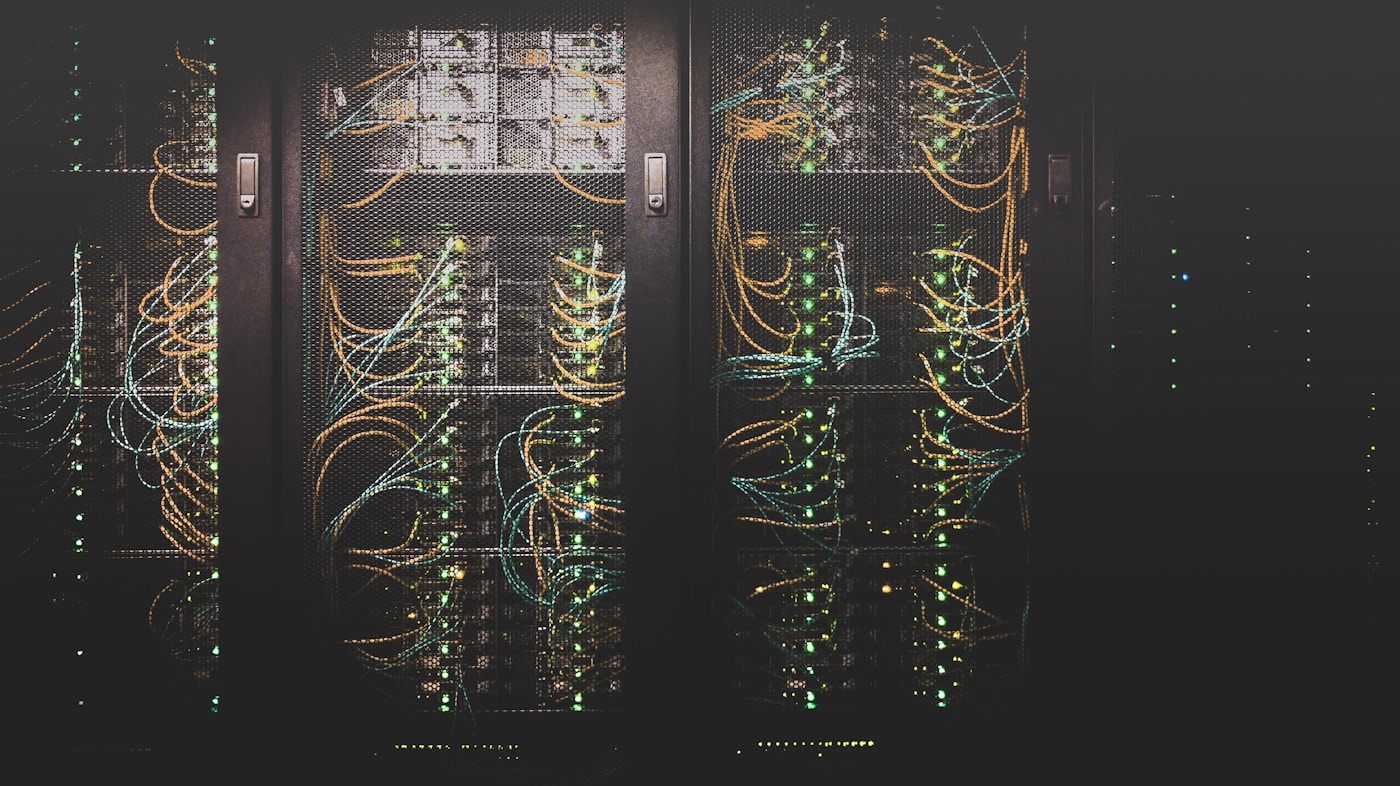 Server room with blinking warning lights representing a failing ETL pipeline at night