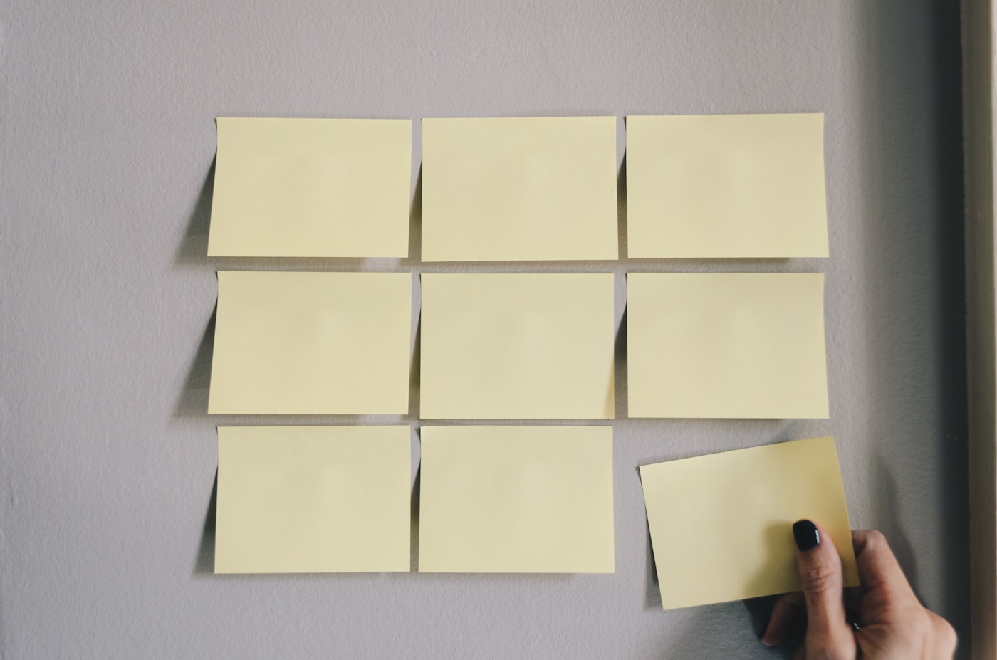 Notebook with written notes next to a laptop, representing documentation and data engineering planning