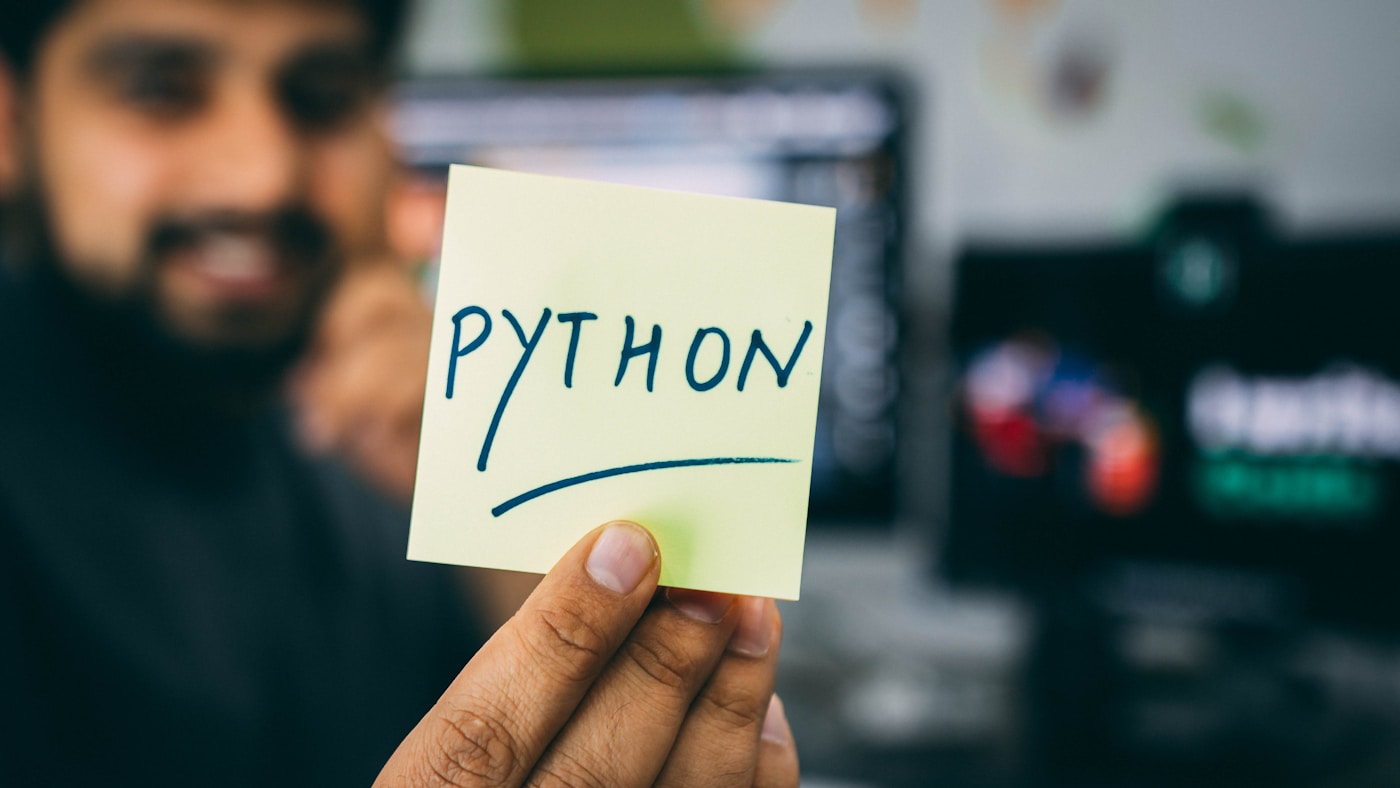 Python code on a dark monitor screen representing data engineering scripts