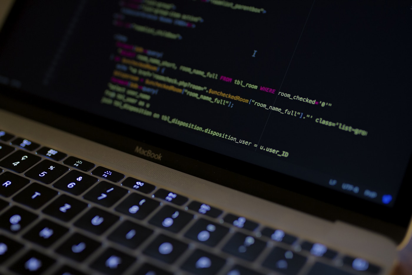 Code editor showing SQL queries on a dark screen
